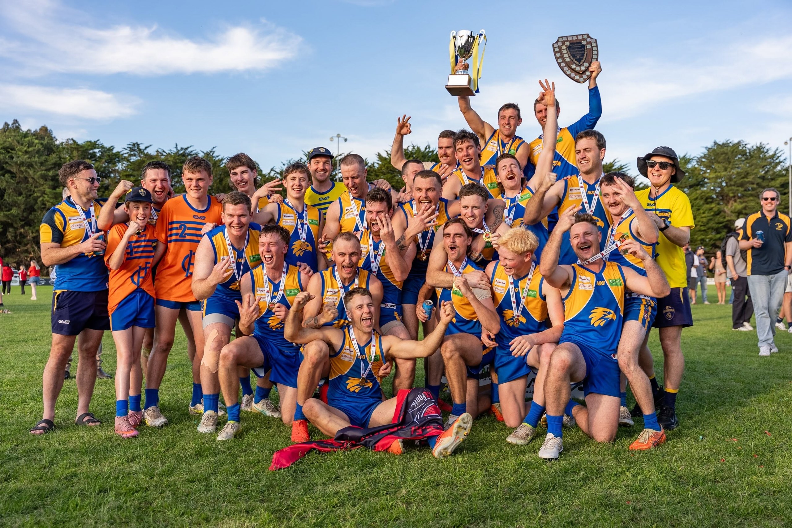 Hatherleigh A Grade players celebrate the 2026 MSEFL premiership with the cup and shield